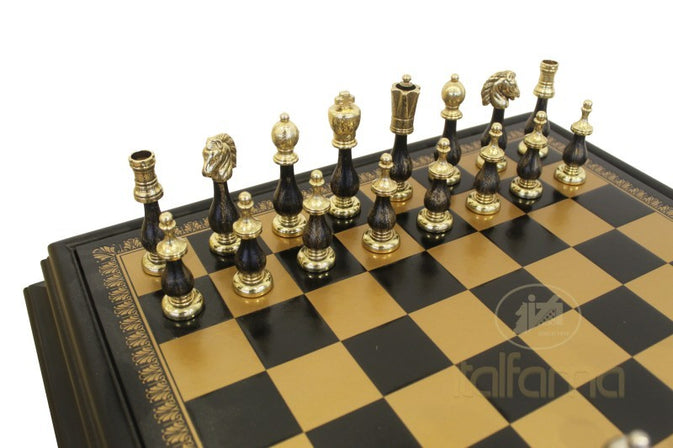 Decorative chess set with black and gold pieces on a checkered board.