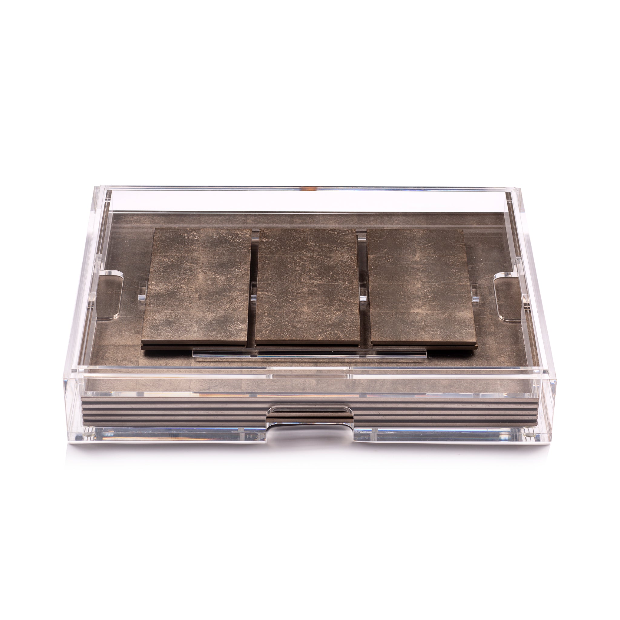 Three metallic brake pads in a clear plastic case on a white background