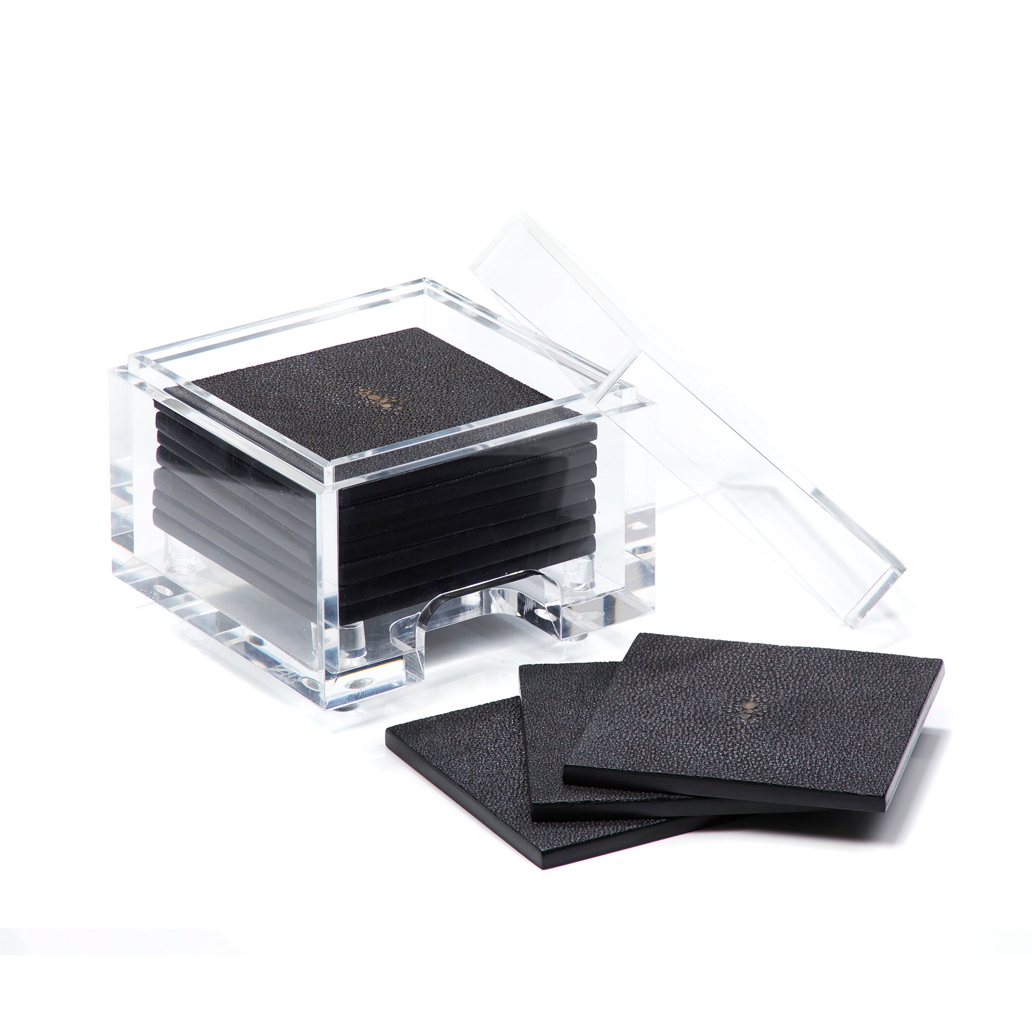 Set of black coasters with a clear acrylic holder on a white background