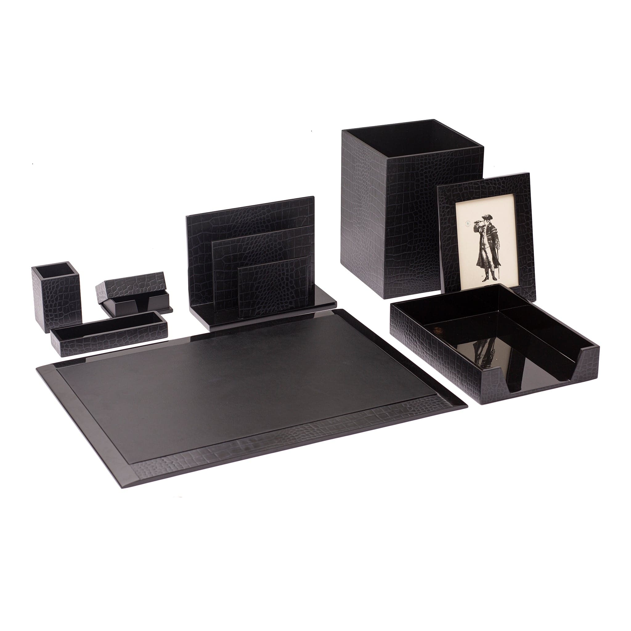 Black desk set with various items including a photo frame on a white background