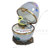 Gray musical egg with a Canary by Fanex France - Main View