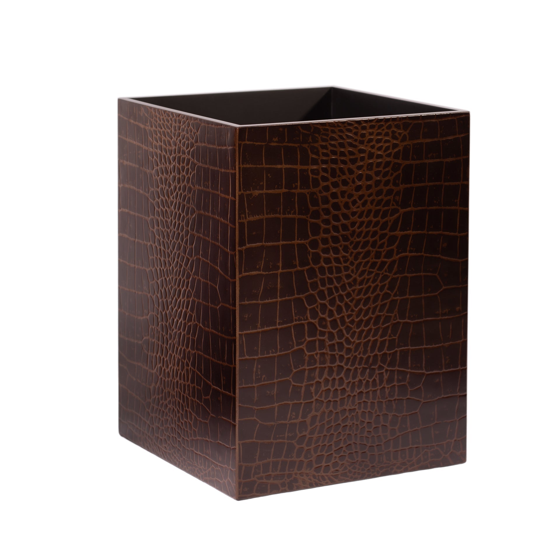 Brown crocodile patterned waste bin on a white background