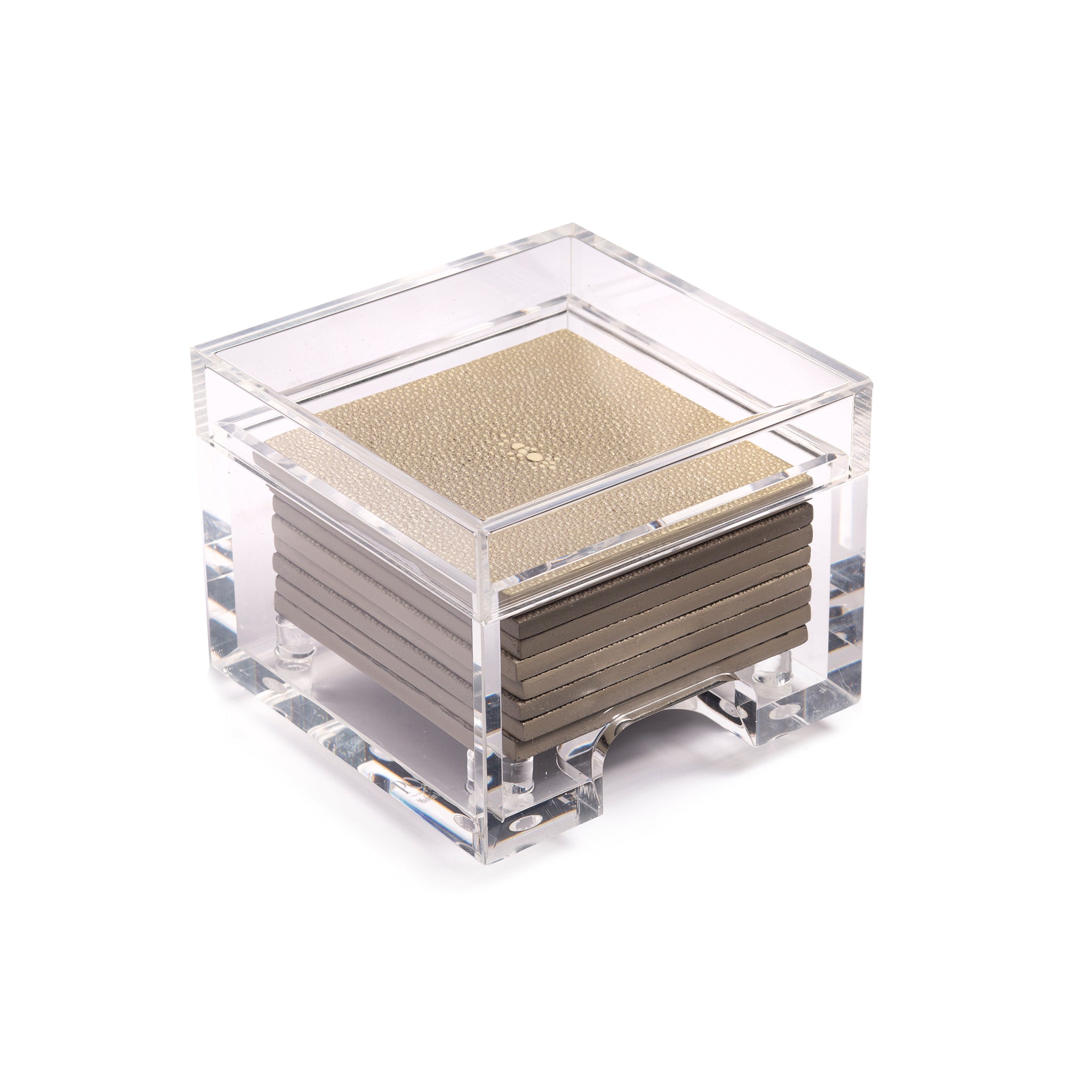 Set of coasters in a clear acrylic holder on a white background