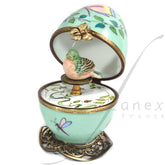 Pale green musical egg with a bird by Fanex France - Main View