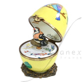 Yellow musical egg with a colorful bird by Fanex France - Main View