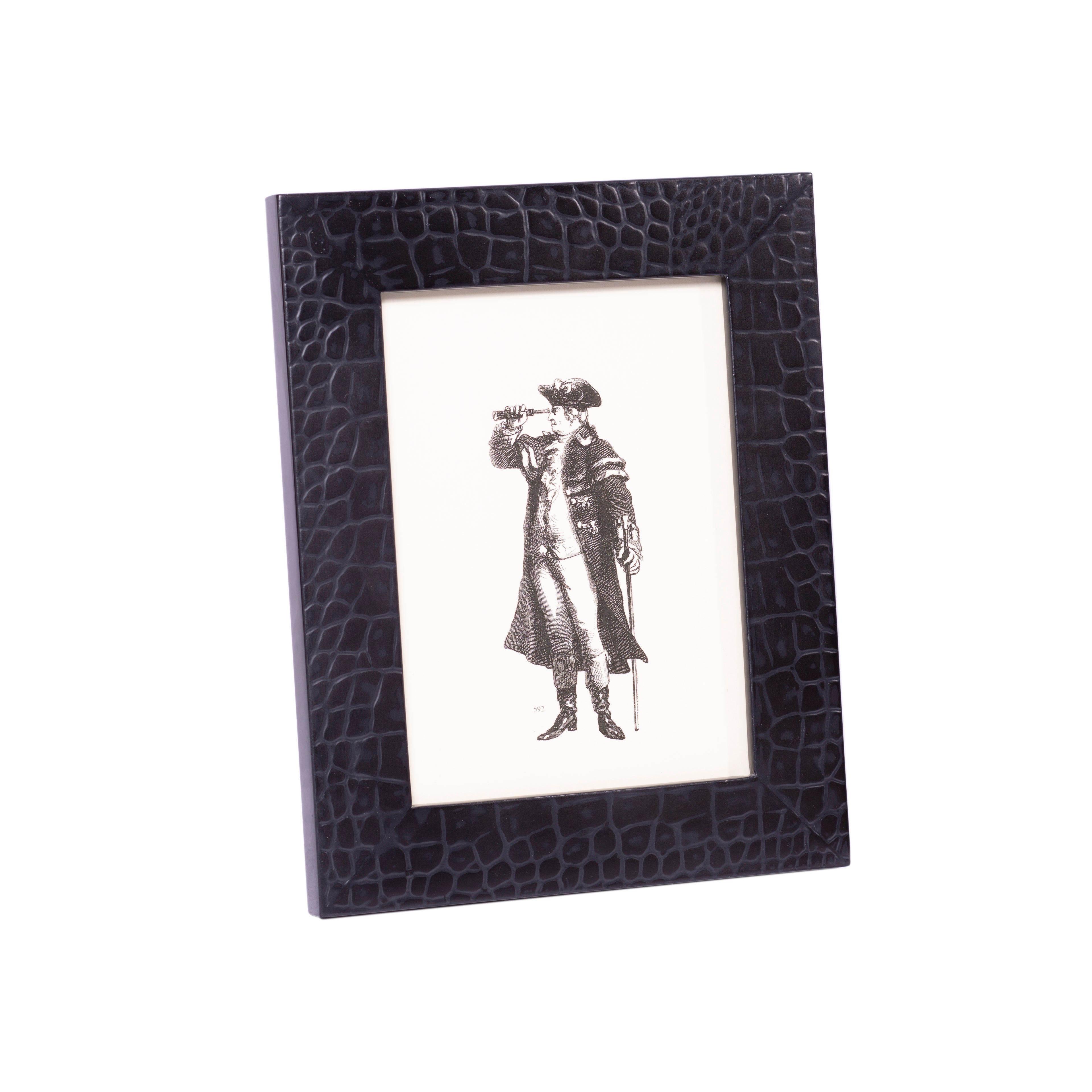 Black framed picture with a person in a coat and hat on a white background