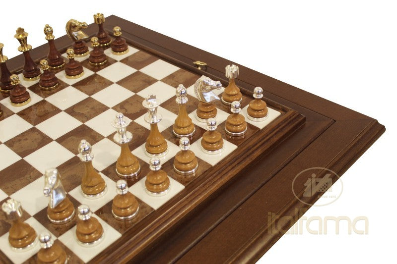 Wooden chessboard with checkered pattern and chess pieces on a white background, featuring the brand 'italiana'.