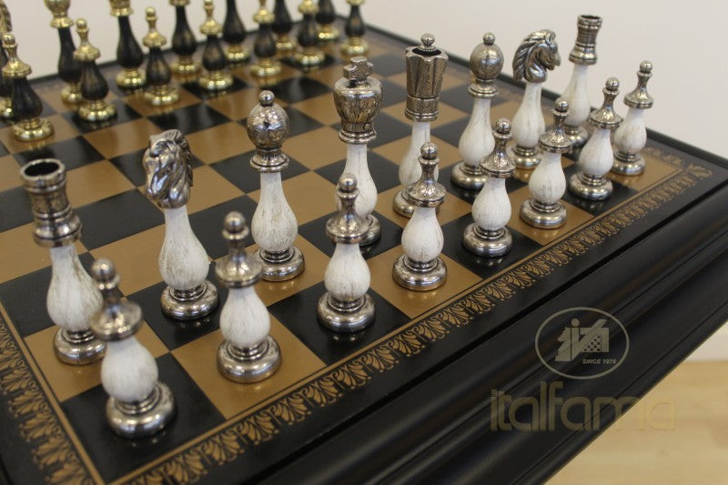 Luxury chess set with ornate pieces on a checkered board, featuring the Italfama brand.