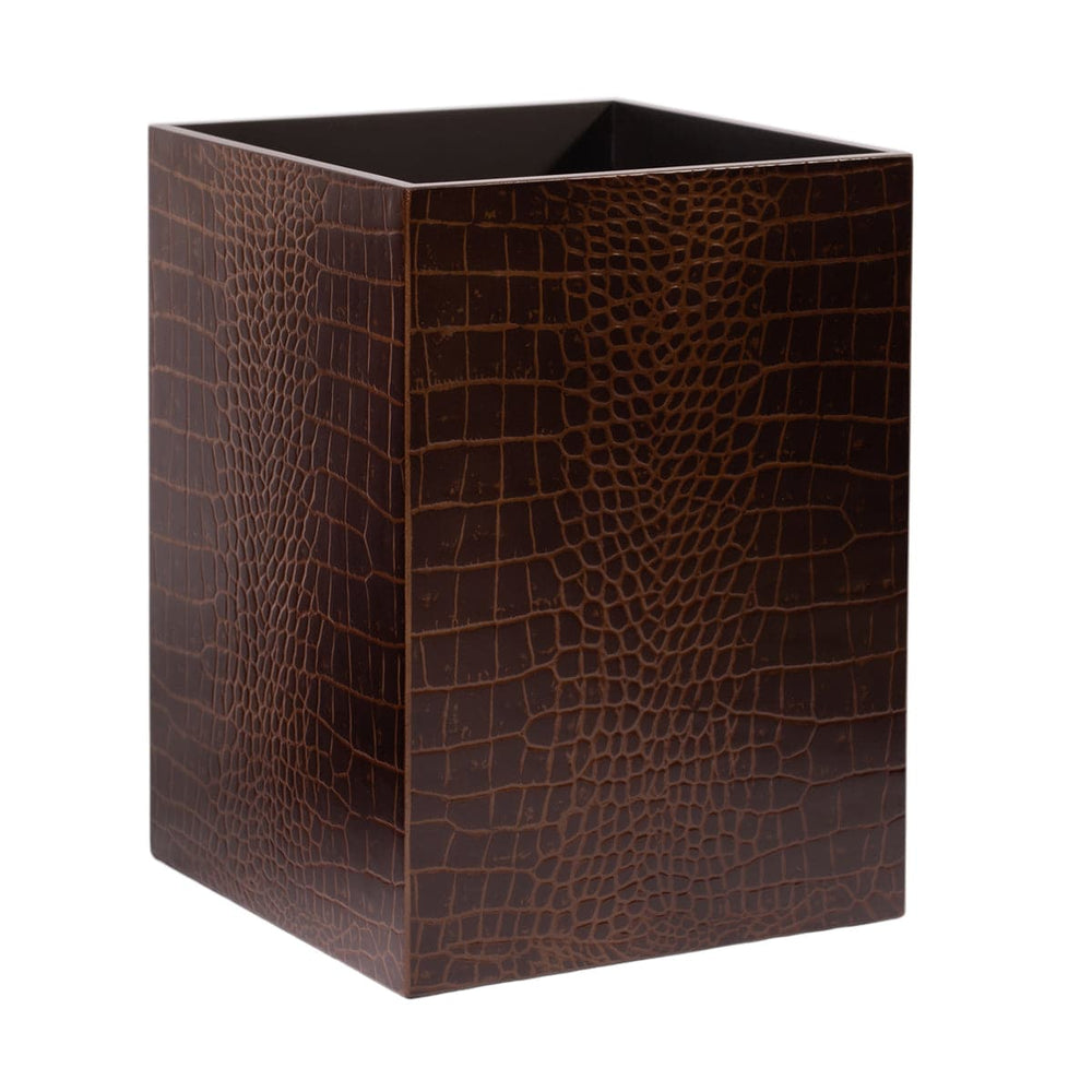 Brown crocodile patterned waste bin on a white background