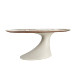 Oval dining table in porcelain marble and sand-coloured epoxy fiberglass