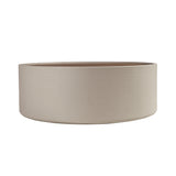 Round coffee table in walnut and wood upholstered in sand-coloured leatherette