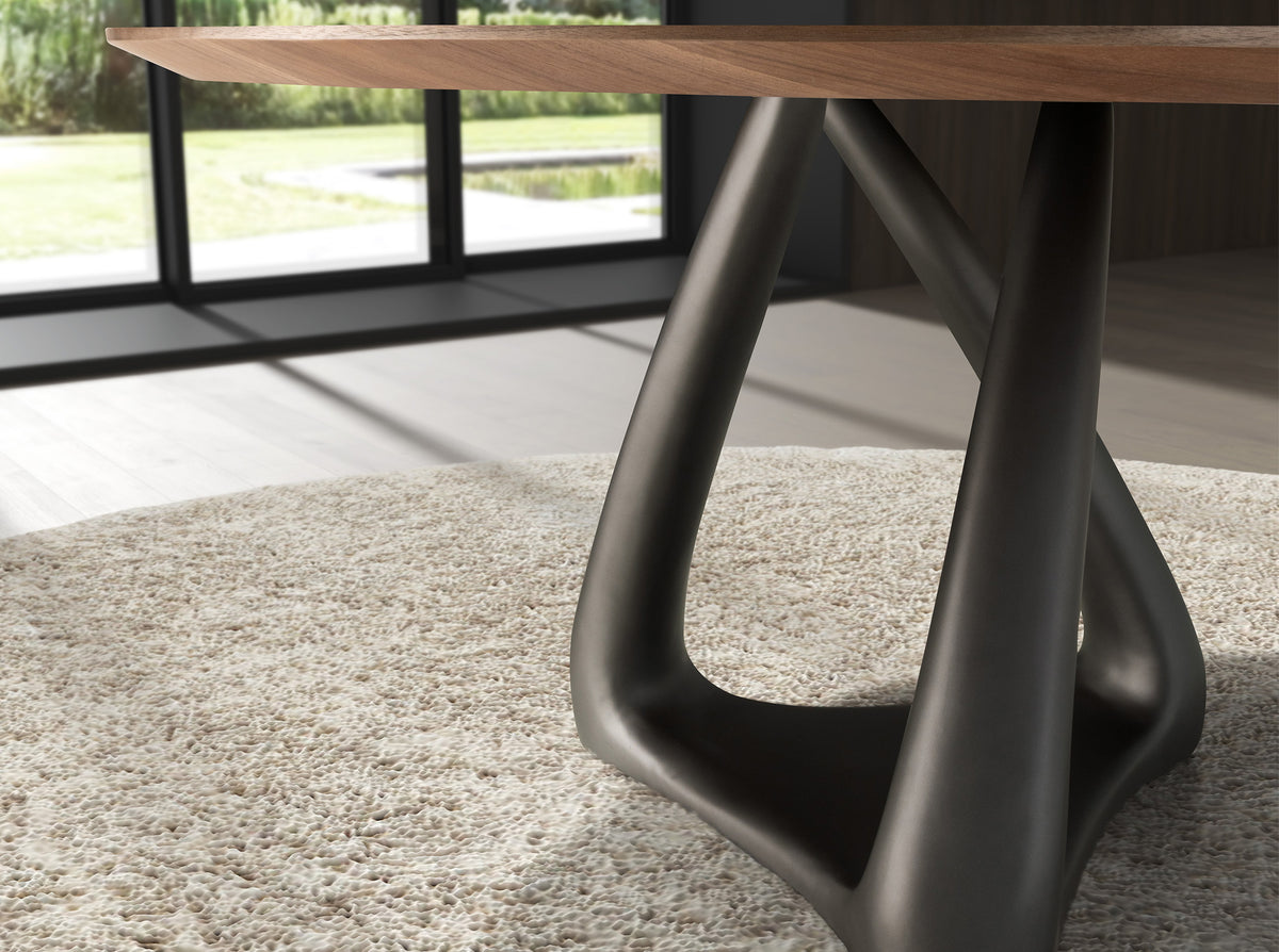 Round dining table in walnut, dark grey fiberglass and metal