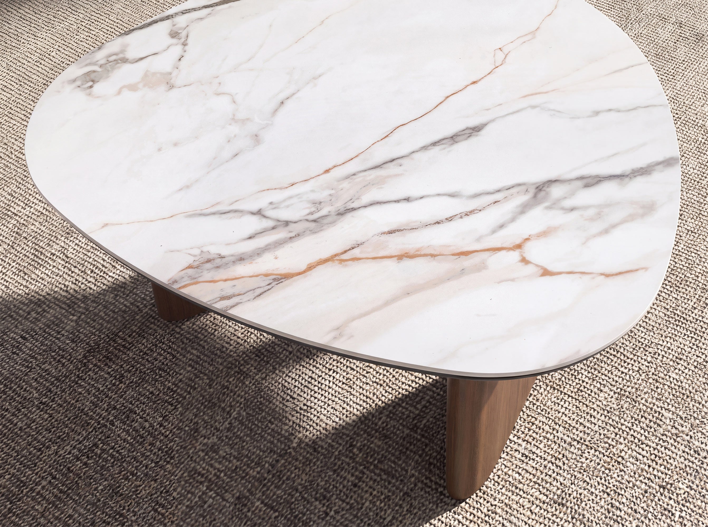 Organic-shape coffee table in porcelain marble and walnut