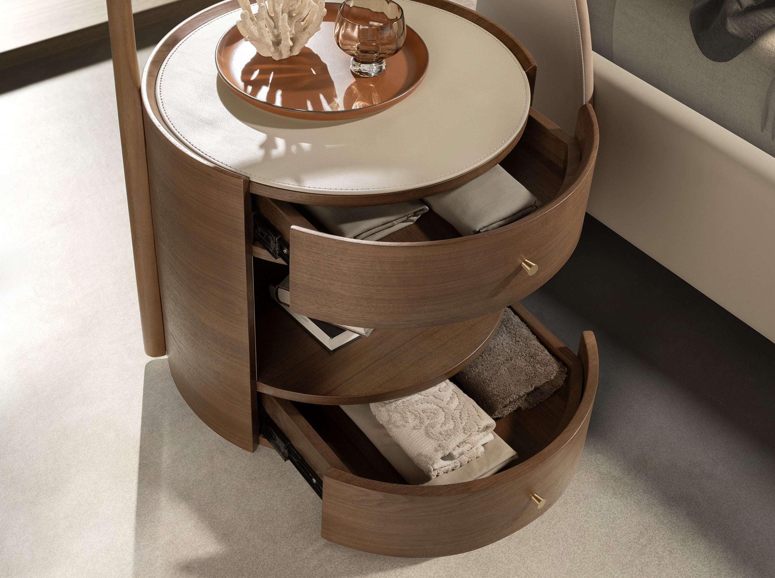Walnut bedside table with cream-coloured leather top