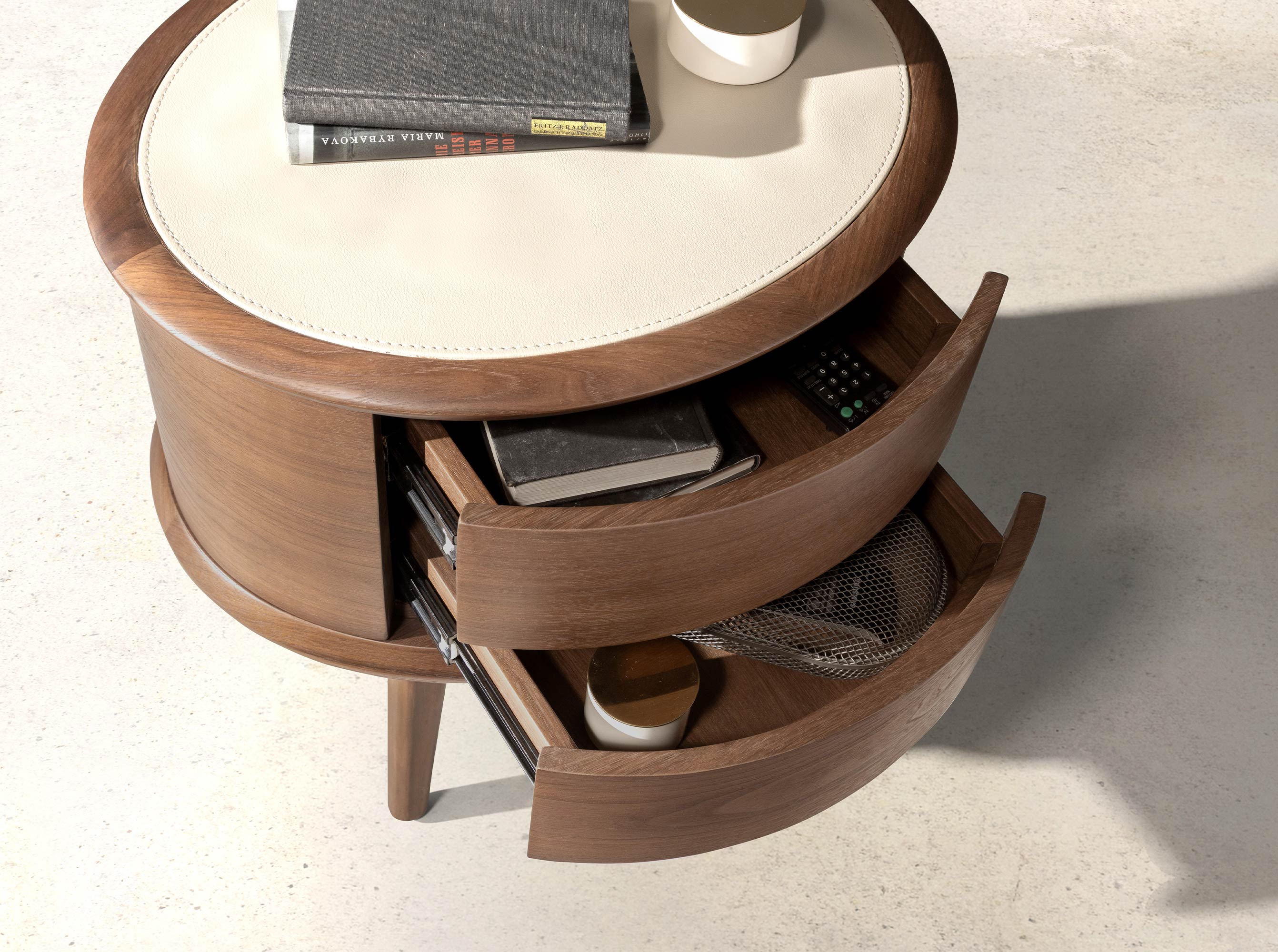 Walnut bedside table with cream-coloured leather top