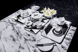 Carrara dinner plate close-up — hand-painted gold edge on premium Portuguese porcelain