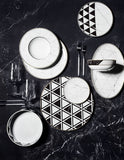 Carrara dinner set table arrangement showcasing geometric Carrara-marble pattern and gold rim — Vista Alegre