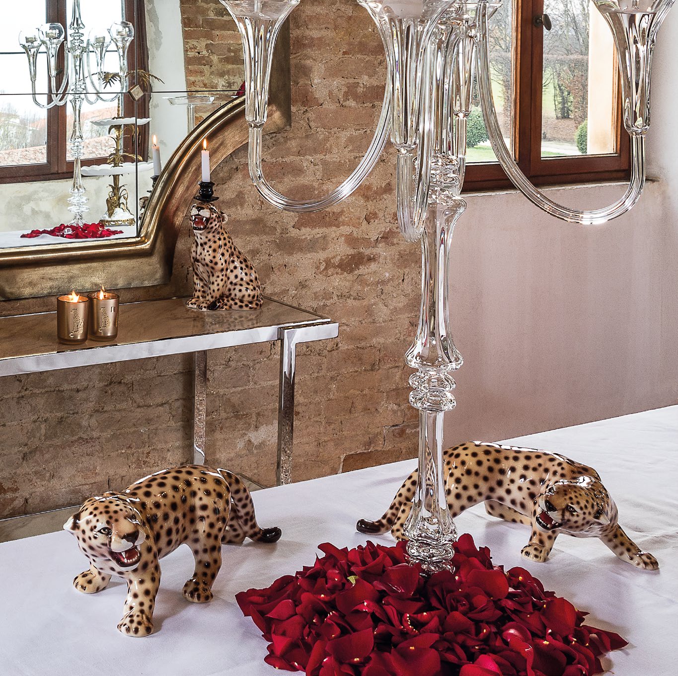 Abhika Seated Cheetah Candleholder on a console with the Cheetah Pair