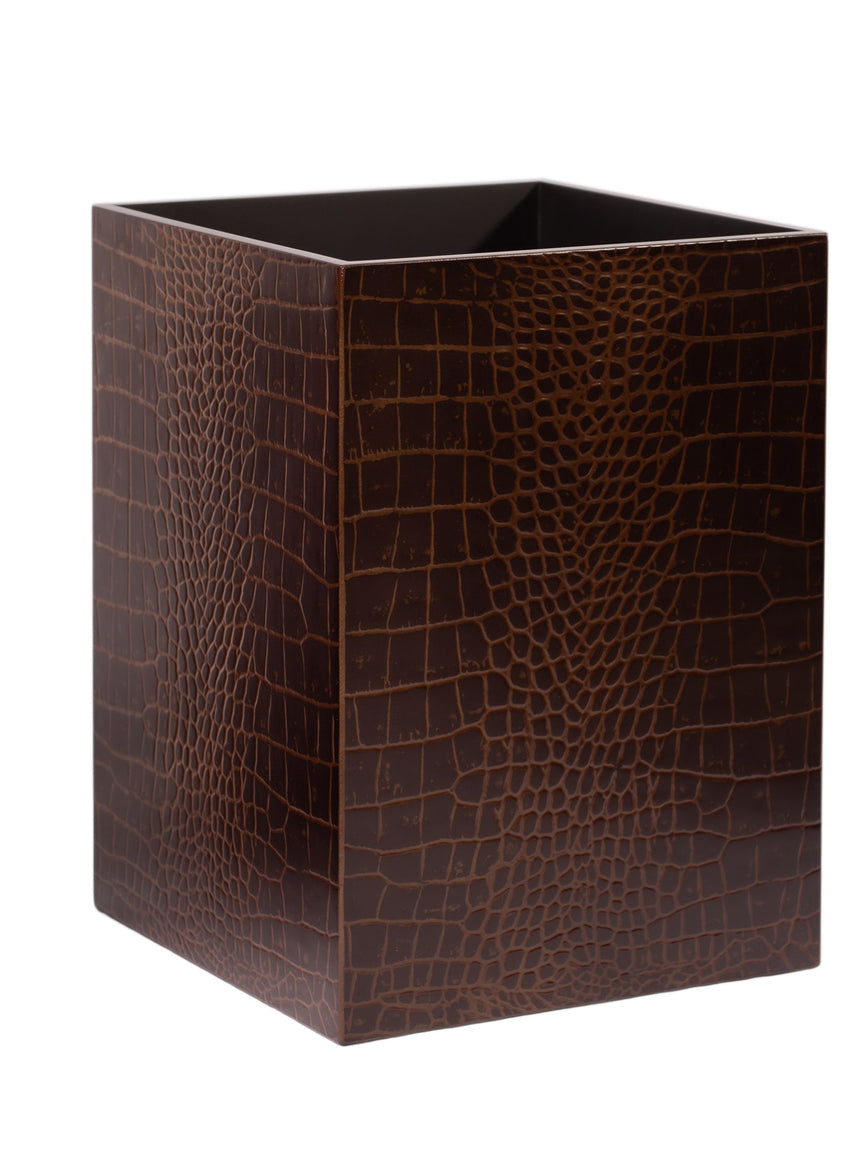 Brown crocodile patterned waste bin on a white background