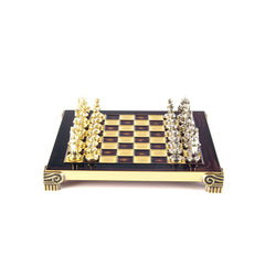 Chessboard with gold and silver chess pieces on a white background